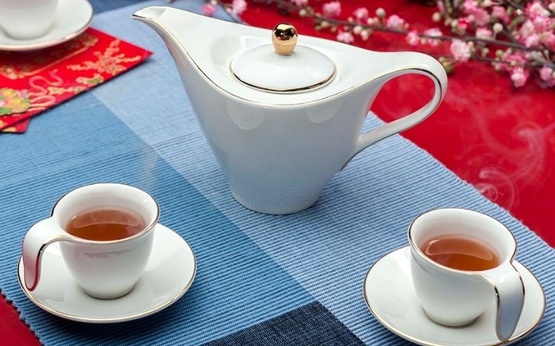 in logo ấm chén - quà tặng bàn giao nhà